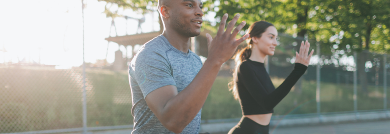 man and woman exercising outside