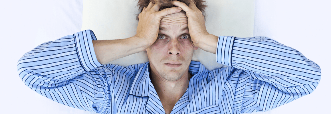 Itchy Skin at Night - Guy waking up in bed panicked