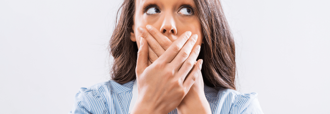 perioral dermatitis - woman holding hand over mouth