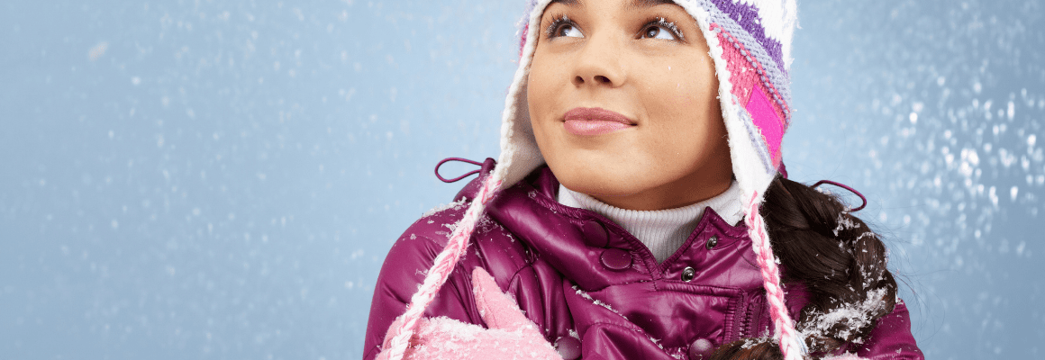 cold and sensitive skin - child wearing winter clothing and smiling