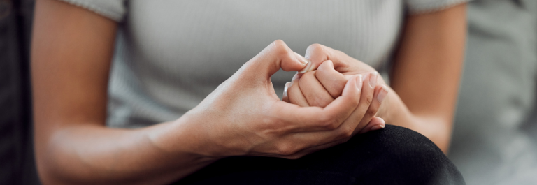 woman picking compulsively at skin on her hand