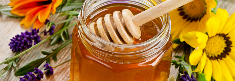 honey and honey ladle with flowers